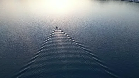 Boat sailing on the bay at sunset Видео 330535279