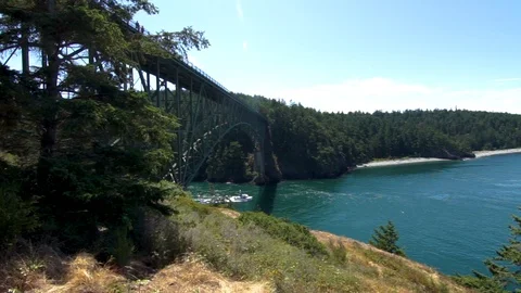 Boat sailing beneath a large bridge Stock Footage 111849358