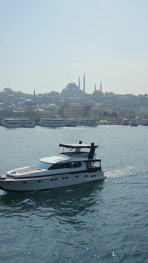Boat sailing on the Bosphorus with Mosque in the background Video stock 323753132