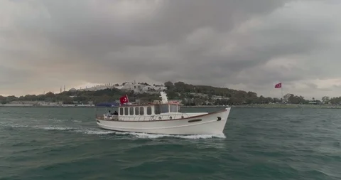Boat Sailing Bosphorus Topkapi Palace in Background Aerial View Stock Footage 102098996