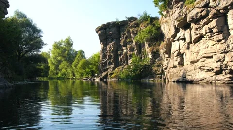 Boat sailing in canyon between high cliff . Stock Footage 65367046