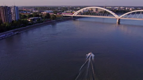 Boat Sailing Down River Next to Zezelj Bridge Stock Footage 272868658