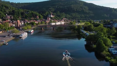 The boat is sailing fast on the river under the bridge Stock Footage 155188844