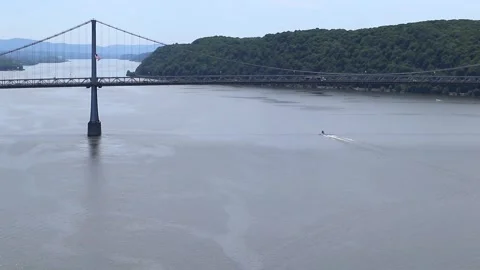 Boat sailing on hudson river with view of mid hudson bridge distant mountains Video stock 278051316