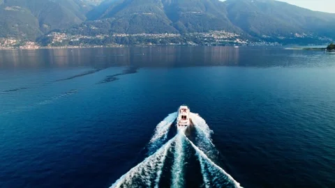 Boat sailing on a lake during sunset. Drone 4k footage. Stock Footage 248708016