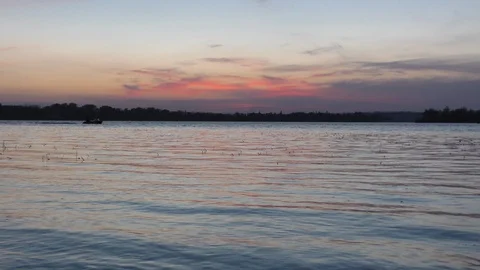 Boat sailing on the river at sunset Stock Footage 97759789
