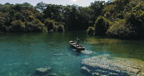 Boat sailing on river through the Amazon region Stock Footage 162521381