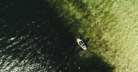 Boat sailing on river through the Amazon region Stock Footage 162523131