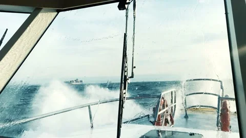 Boat sailing on sea with big waves and bad weather day Stock Footage 147077009