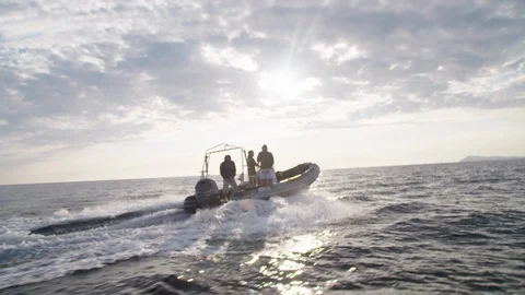 Boat sailing on the sea in front of the sunset - Slow motion Video stock 105301534