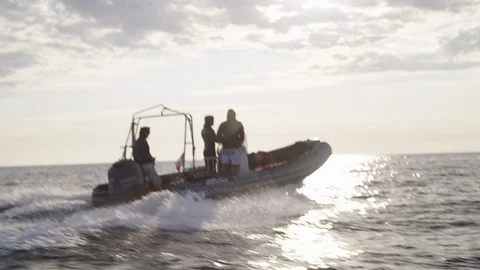 Boat sailing on the sea in front of the sunset - Slow motion Video stock 105302117