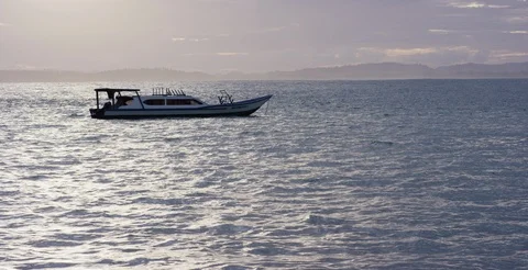 Boat sailing in the sea at sunset Video stock 85757448