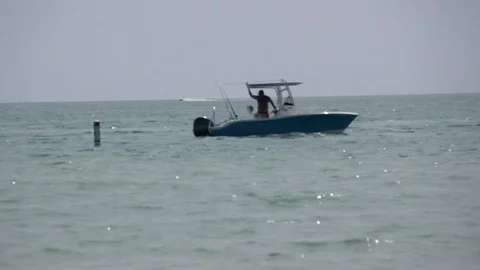 Boat sailing off shore Stock Footage 108415986