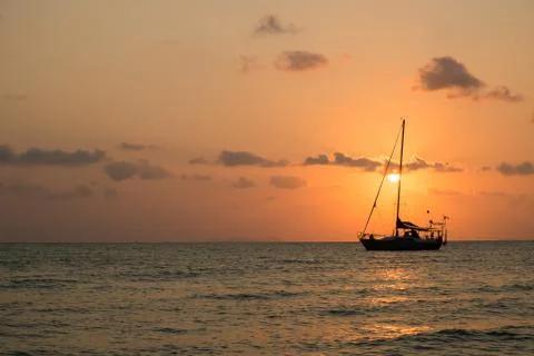 Boat sailing sunset Stock Photos