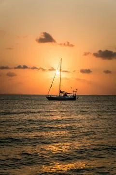 Boat sailing sunset Stock Photos