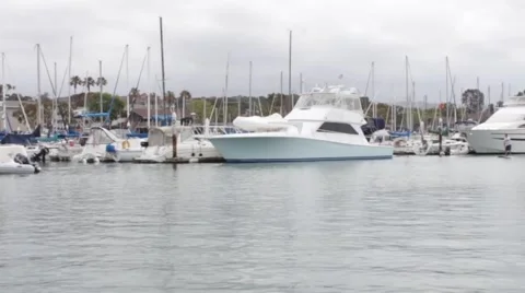 Boat Sailing through Dana Point Harbour Stock Footage 50382769