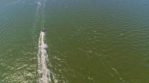 Boat sailing through a lagoon by the ocean Stock Footage 54942946