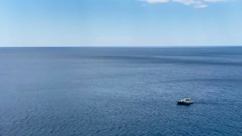 Boat sailing through navy blue Adriatic Sea, in Dubrovnik, Croatia Stock Footage 142736974