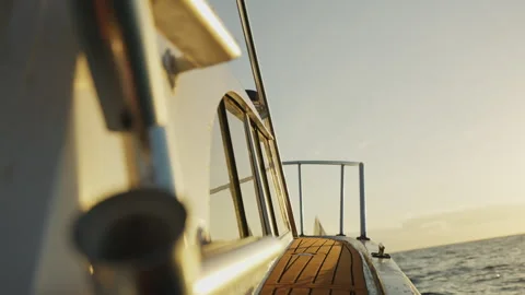 Boat Sailing Through the waves at Sunset Towards Another Sailing Boat 4K Stock Footage 263385634