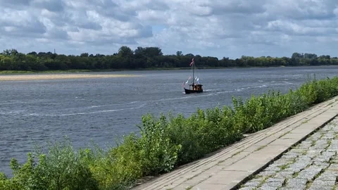 Boat Sailing on the Vistula River in Toruń, Poland Stock Footage 344847834