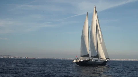 Boat sailing on water with amazing sunset Stock Footage 128925487