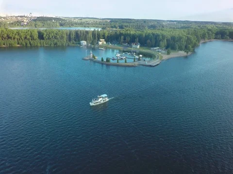 The boat sails across the the lake. Stock Footage 80991691