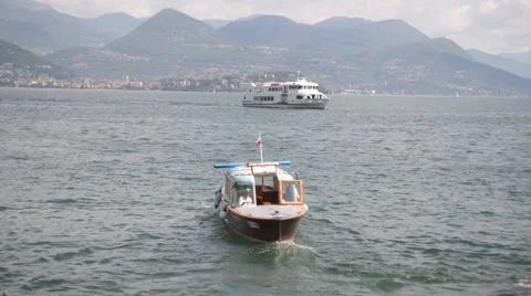 The boat sails away from the coast. Navigation Lago Maggiore. Stock Footage 51884340