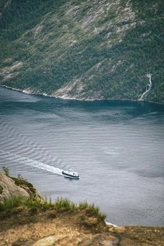 The boat sails between the mountains Stock Photos