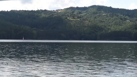 A Boat Sails on a Lake Stock Footage 93869983