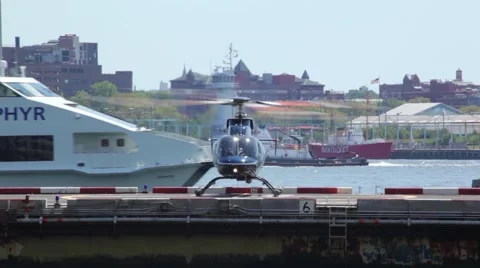 Boat Sails Pass Helicopter Running On Pier NYC Stock Footage 67331116