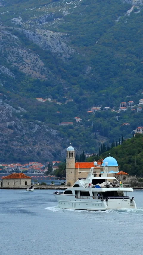 A boat sails before the Perast Stock Footage 293156368