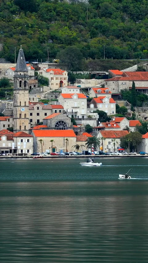 A boat sails before the Perast, old town in Montenegro Stock Footage 293156338