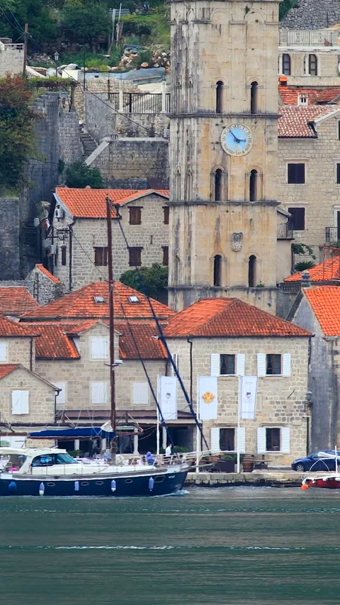 A boat sails before the Perast, old town in Montenegro Stock Footage 293156347