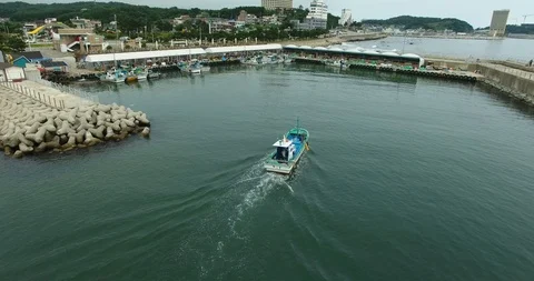 The boat sails to the pier in the bay. Stock-Footage 90224246