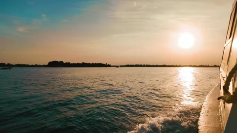 A boat sails into the sunset Stock Footage 280775834
