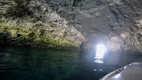 Boat sails through the cave 스톡 동영상 102018578