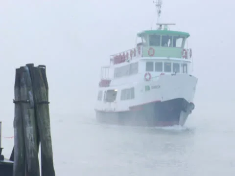 Boat Sails Through Mist Sailing over Winter Water to Boating Dock  Stock Footage 22540275