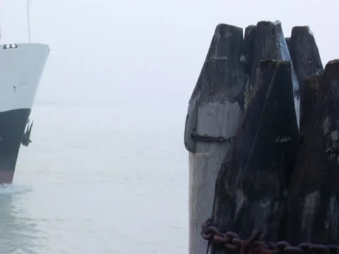 Boat Sails Through Mist Sailing over Winter Water to Boating Dock  Stock Footage 22540880