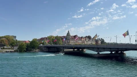 Boat sails through Rhine river under bridge and enters Constance lake. Konstanz Stockbeeldmateriaal 315668880