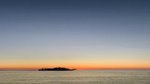 Boat Sails Through Sunset - Vertical Stock Footage 129052995