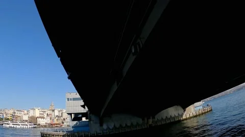 The boat sails under the Galata bridge. Boat ride on the Bosphorus Stock Footage 171289018