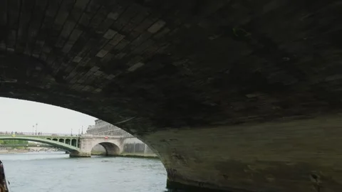 A boat sails under the Pont au Change bridge over the Seine River, Paris, France Stock Footage 308730078