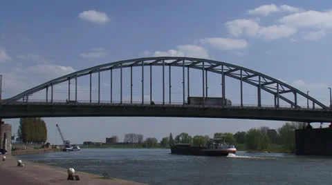Boat sails upstream under John Frost Bridge at Lower Rhine Stock Footage 23141474