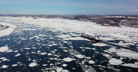 Boat on the Saint Lawrence river in Quebec City in winter from drone Video stock 234739735
