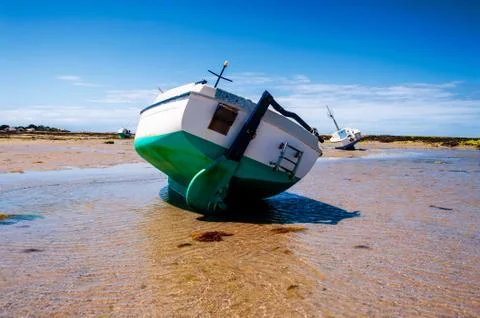 Boat on sand Stock Photos