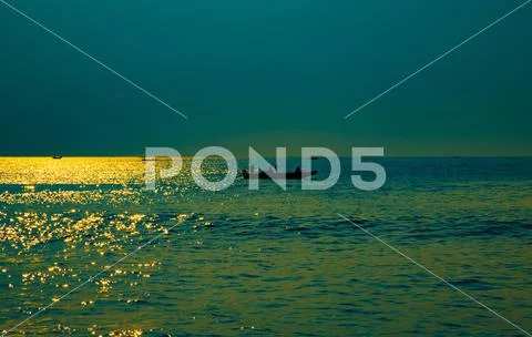 Boat in sea sun raise time landscape wallpaper Stock Photos