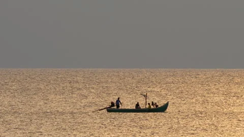 Boat at sea in sunlight backlight, sunset Stock Footage 303424403