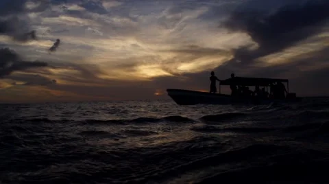 Boat in sea at sunset Stock Footage 68107089