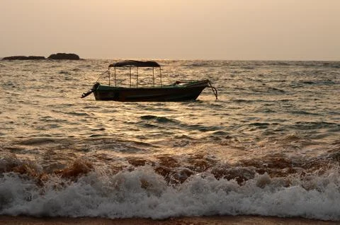 Boat at seashore Stock Photos