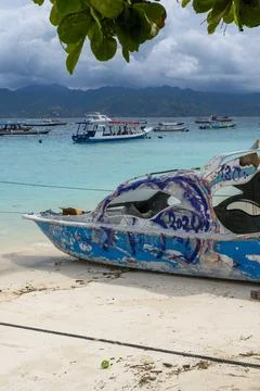 Boat is sitting on the beach 스톡 사진